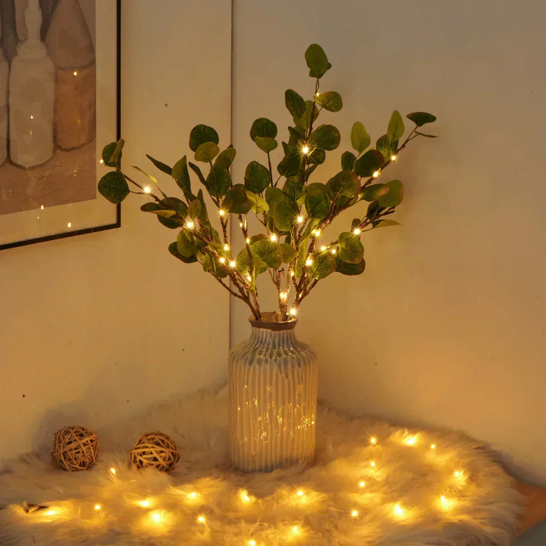 Branche d'olive avec lumières décoratives